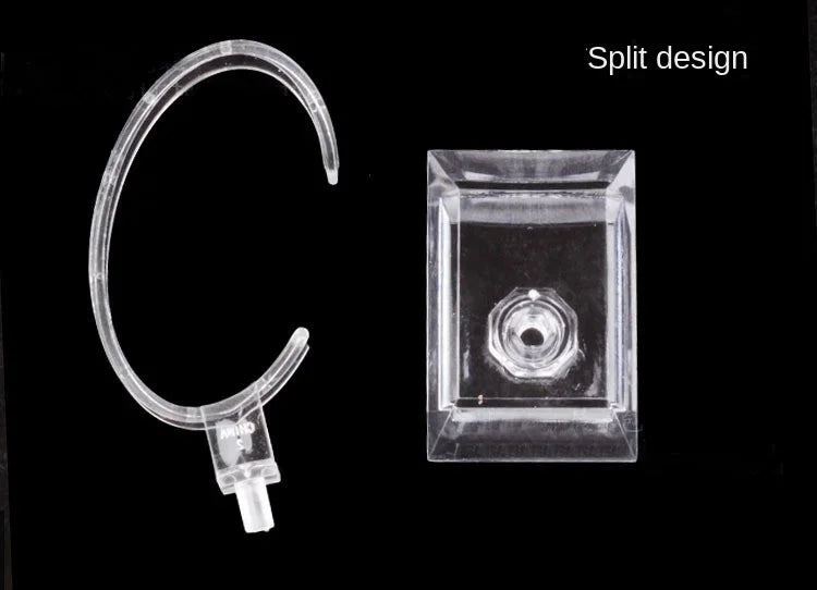 Clear plastic hoop earring and square clip on a black background