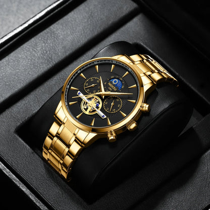 Gold wristwatch with black dial in a black box