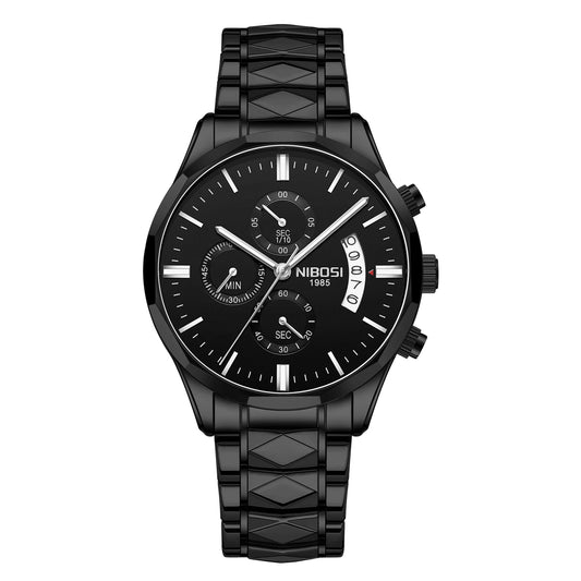 A black chronograph watch with a matching black link bracelet, featuring a multi-dial design, silver-tone hands, and a date window on a white background.