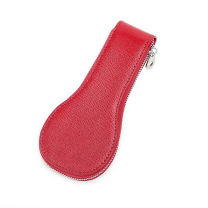 Red leather key case with a zipper on a white background