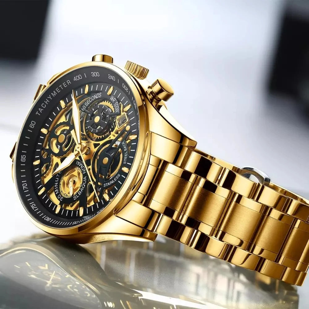 Gold wristwatch with a detailed face on a reflective surface