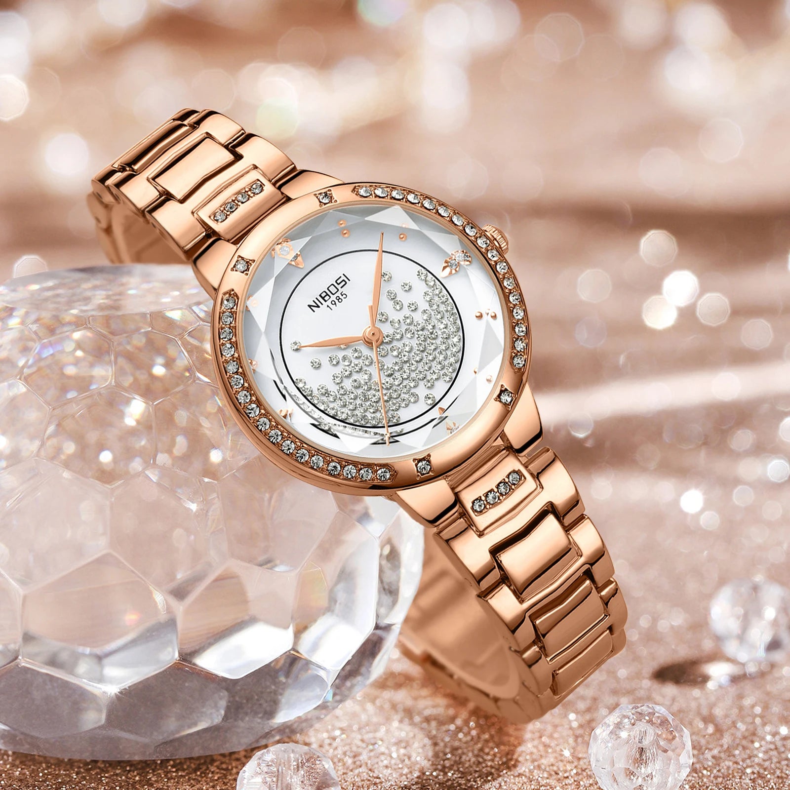 Rose gold watch with diamond accents on a sparkling background