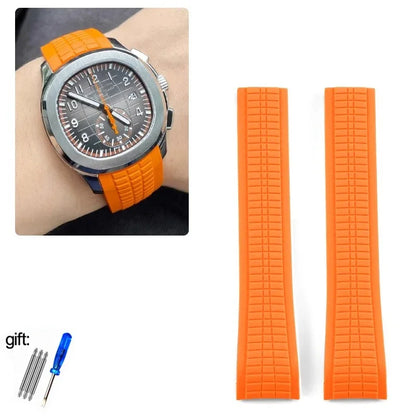 Orange watch strap with watch face inset and tool set on white background