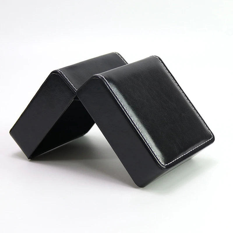Glossy black jewelry box on a white background