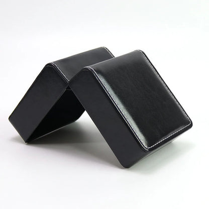 Glossy black jewelry box on a white background