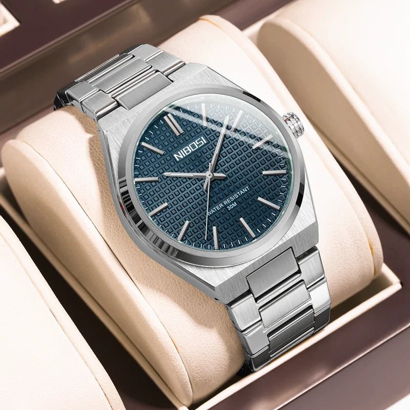 Silver watch with blue dial in a beige box