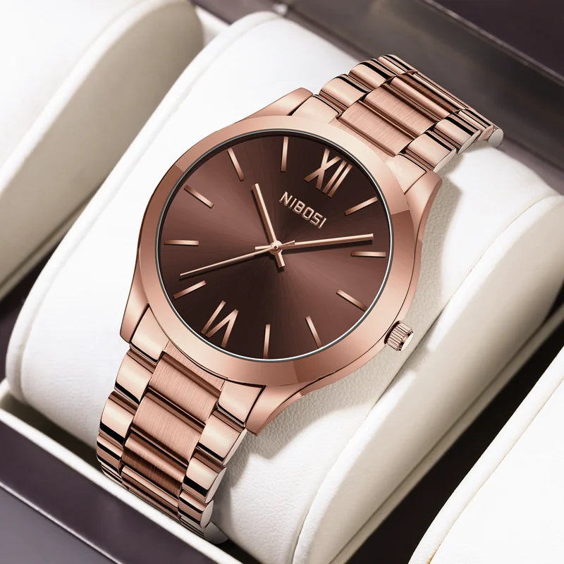 Rose gold watch with brown dial on a white cushion, brand 'NIBOSI' visible