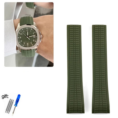 Green watch with matching strap on wrist, two additional green straps, and a tool set on a white background.