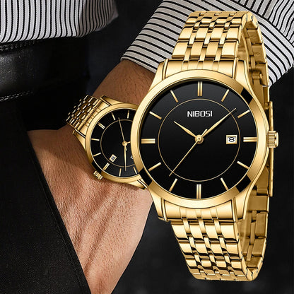 Gold wristwatch with black dial on a person's wrist, brand 'NIBOSI' visible