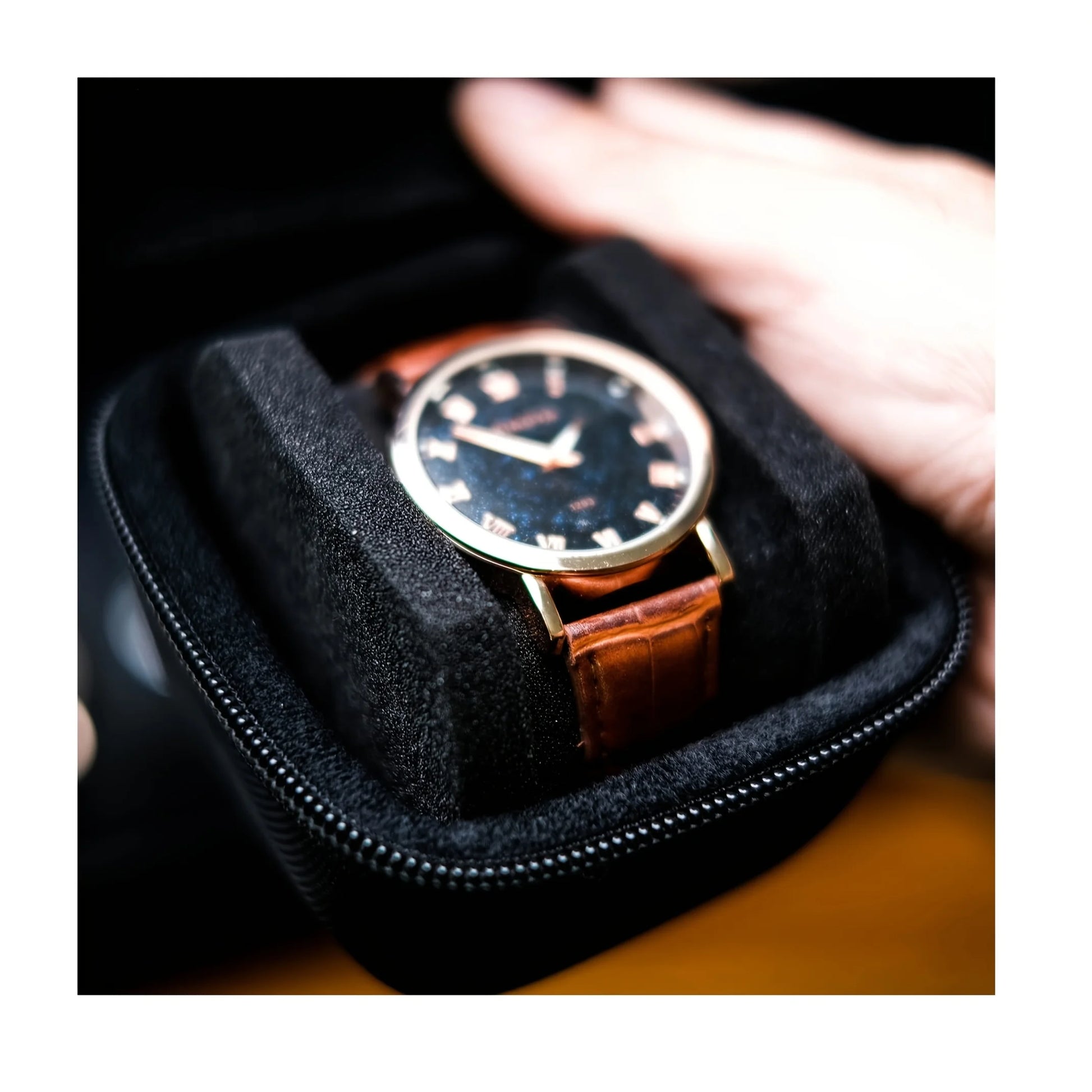 Watch with brown leather strap in a black case