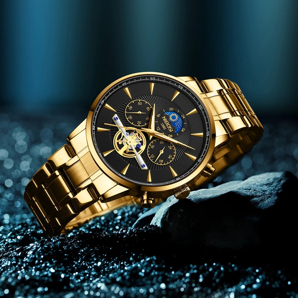 Gold wristwatch with a detailed face on a dark textured surface
