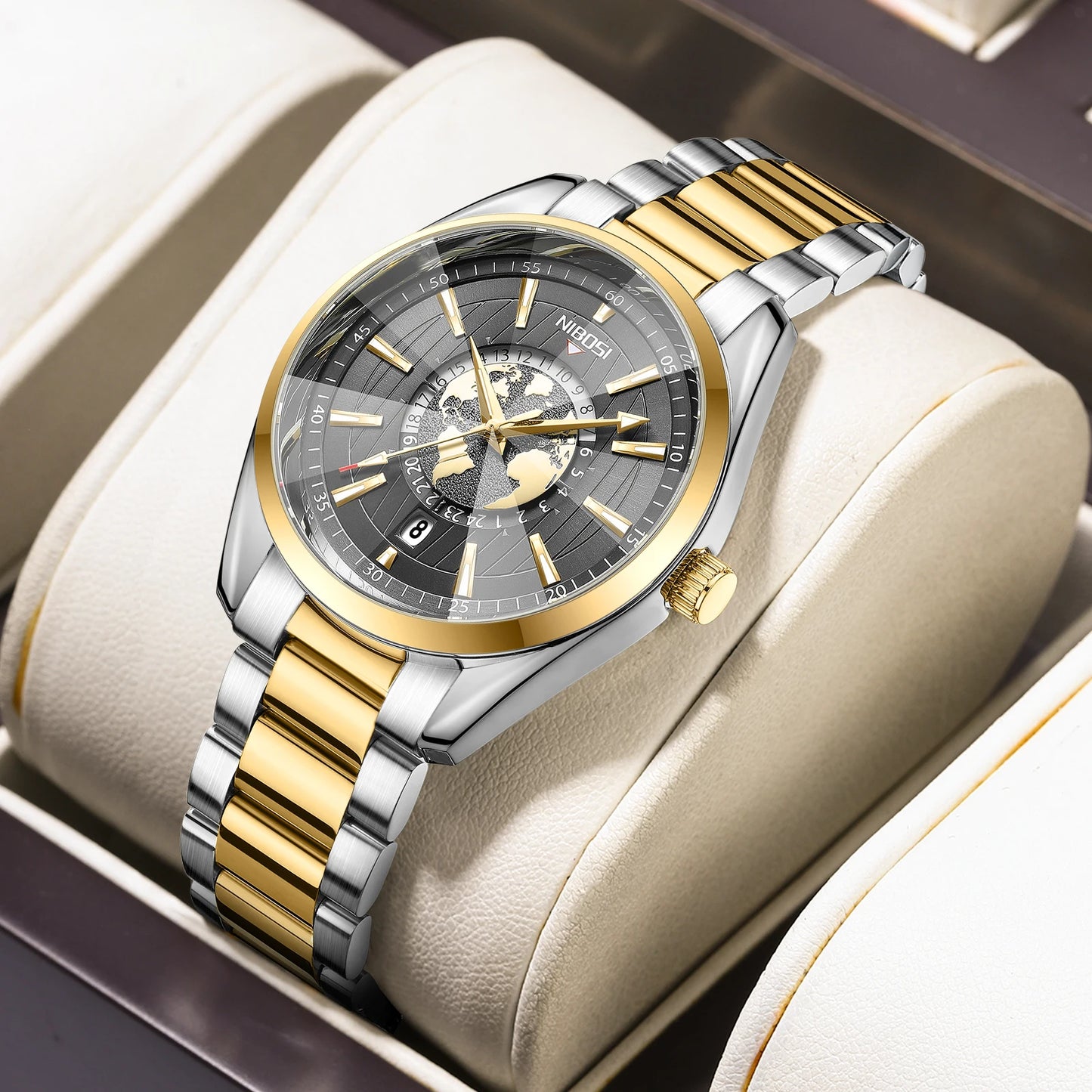 Luxury watch with gold and silver band on a beige cushion