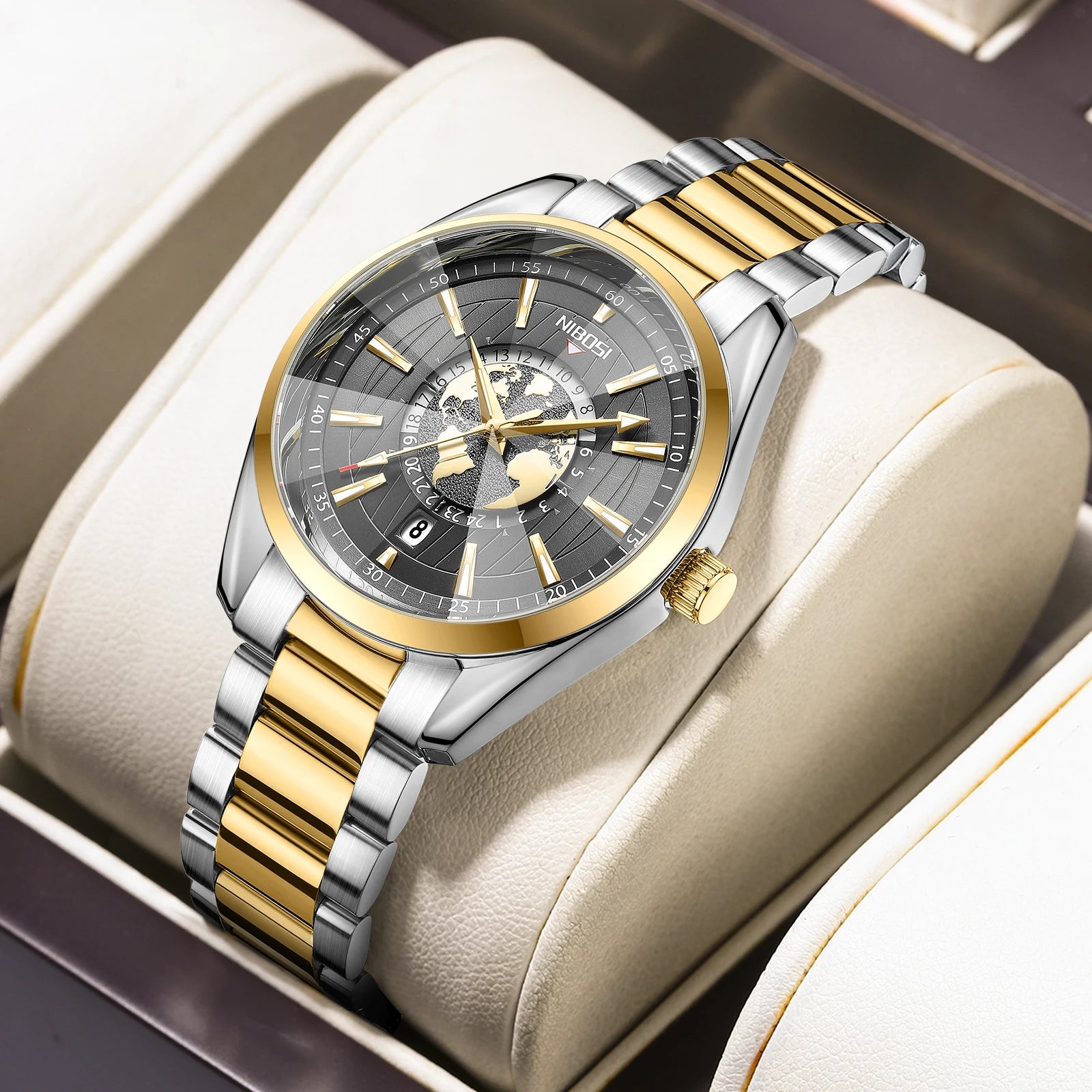 Luxury watch with gold and silver band on a beige cushion