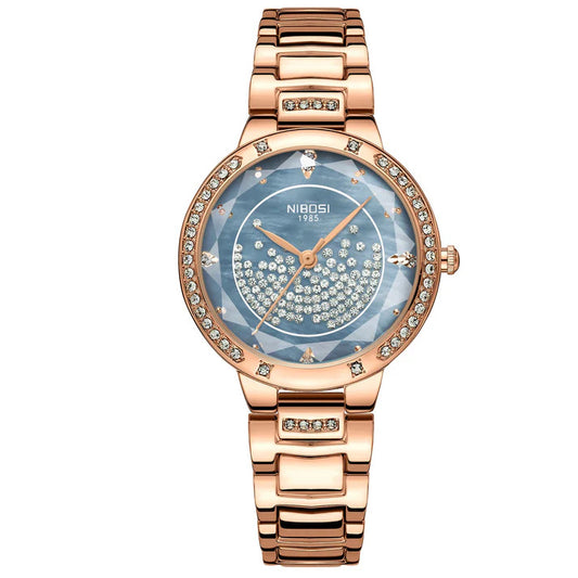 Rose gold watch with a blue face on a white background