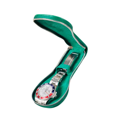 Silver watch with a green zipper case on a white background